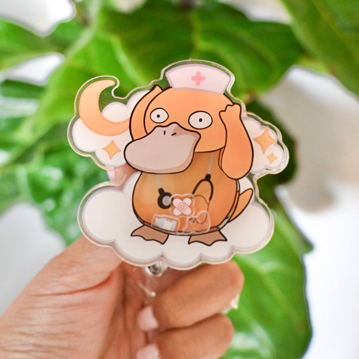 POKEMON - PSYDUCK MEDICAL THEMED ACRYLIC SHAKER BADGE REEL