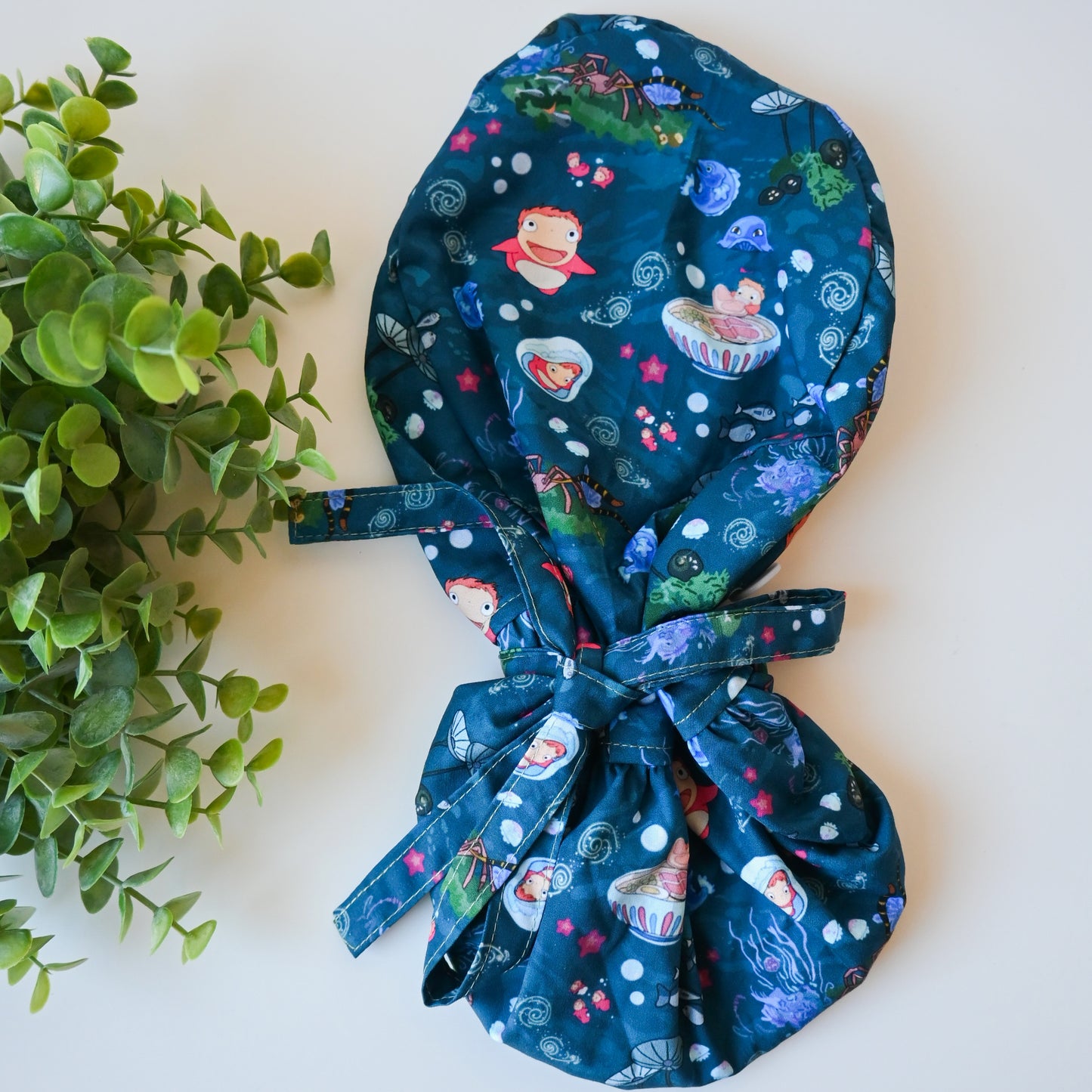 PONYO - DARK BLUE PONYO WITH SEA CREATURES SATIN LINED PONYTAIL SCRUB CAP