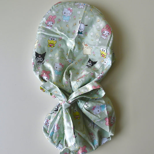 SANRIO CHARACTERS IN GRASS WITH FLOWERS SATIN LINED PONYTAIL SCRUB CAP