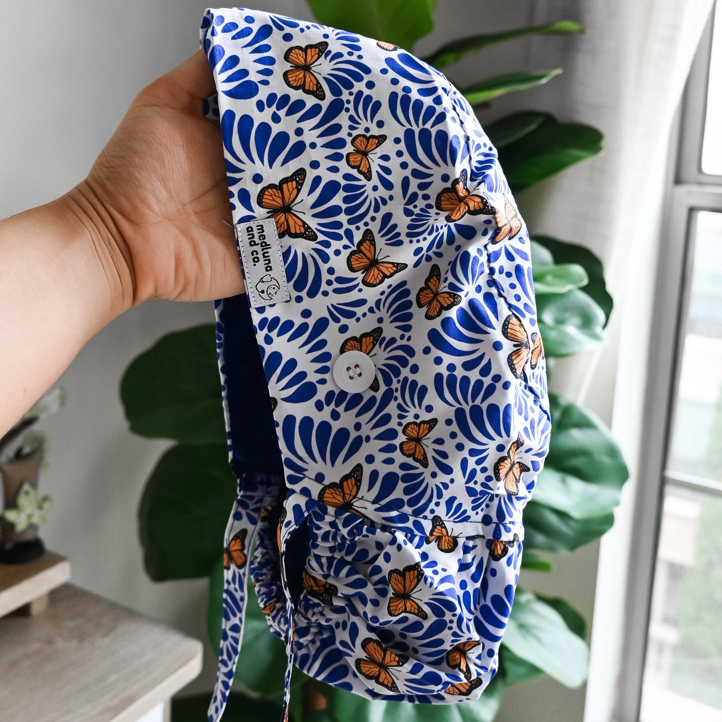 BLUE TALAVERA WITH MONARCH BUTTERFLIES SATIN LINED PONYTAIL SCRUB CAP