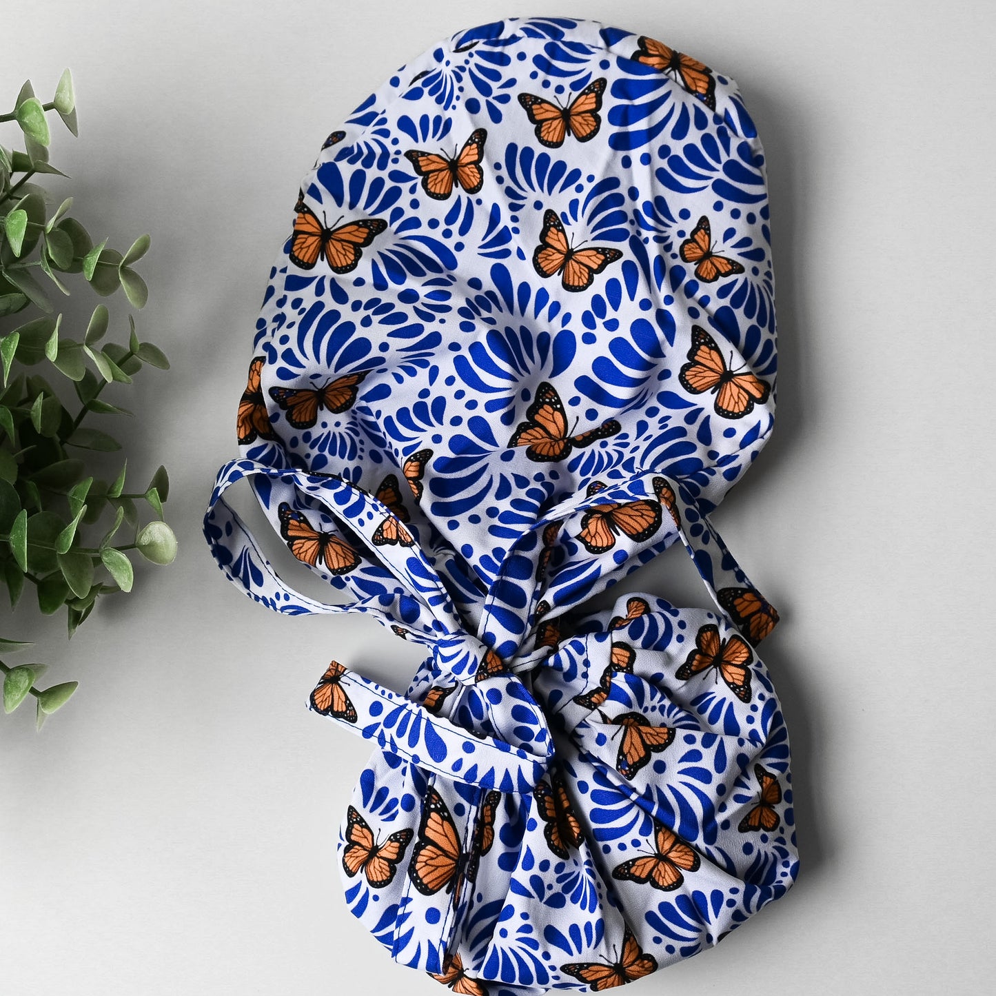 BLUE TALAVERA WITH MONARCH BUTTERFLIES SATIN LINED PONYTAIL SCRUB CAP