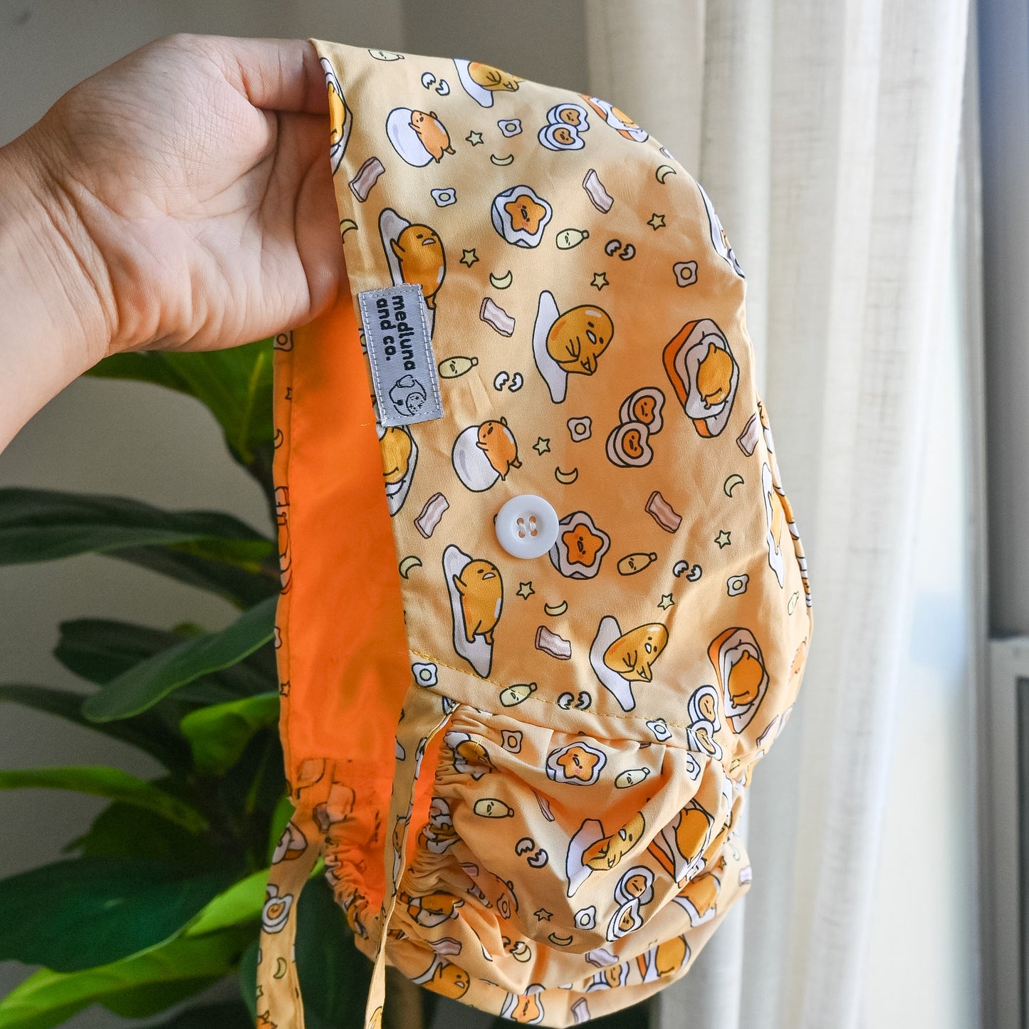 GUDETAMA THEMED SATIN LINED PONYTAIL SCRUB CAP