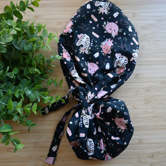 ANATOMICAL FLORAL THEMED SATIN LINED PONYTAIL SCRUB CAP