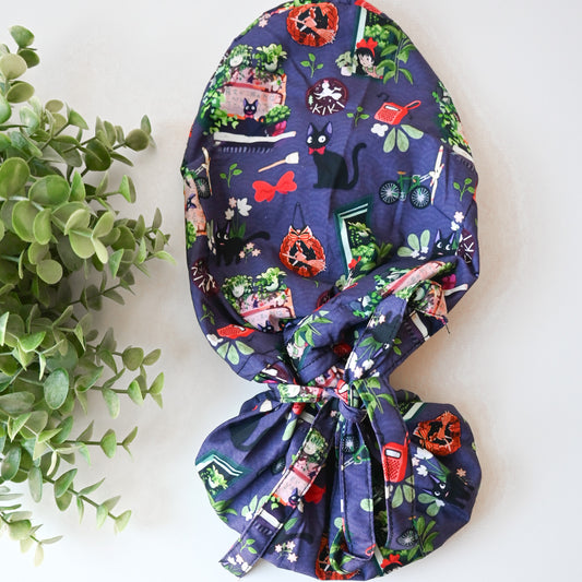 KIKI'S DELIVERY SERVICE - PURPLE JIJI WITH PLANTS SATIN LINED PONYTAIL SCRUB CAP