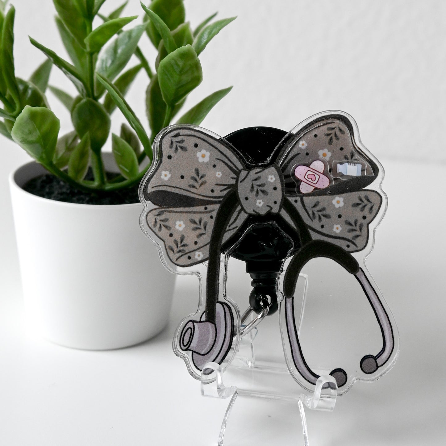 STETHOSCOPE BOW GREEN PLANT WITH FLOWERS THEMED ACRYLIC SHAKER BADGE REEL