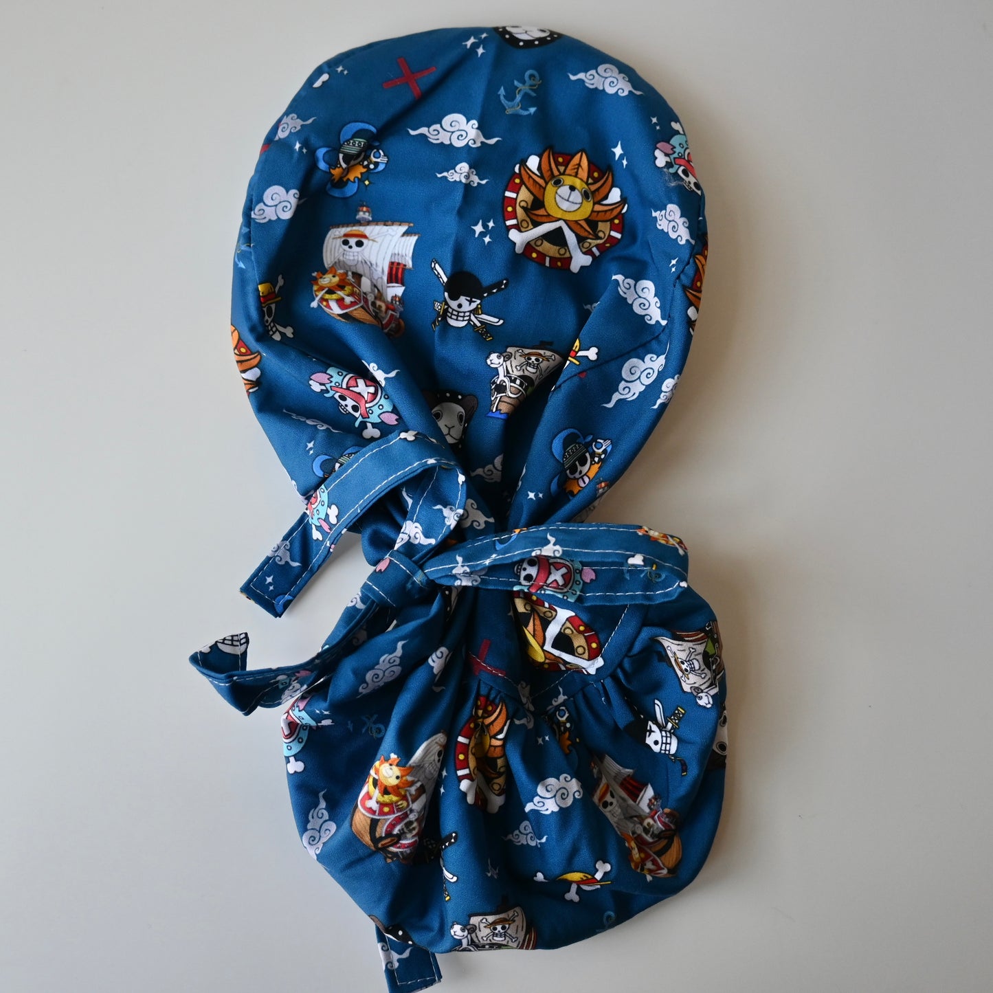 ONE PIECE - THOUSAND SUNNY AND GOING MERRY THEMED SATIN LINED PONYTAIL SCRUB CAP