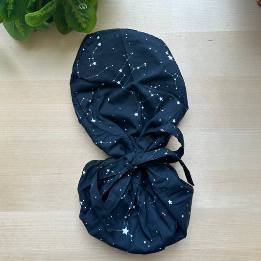 BLACK CONSTELLATIONS SATIN LINED PONYTAIL SCRUB CAP