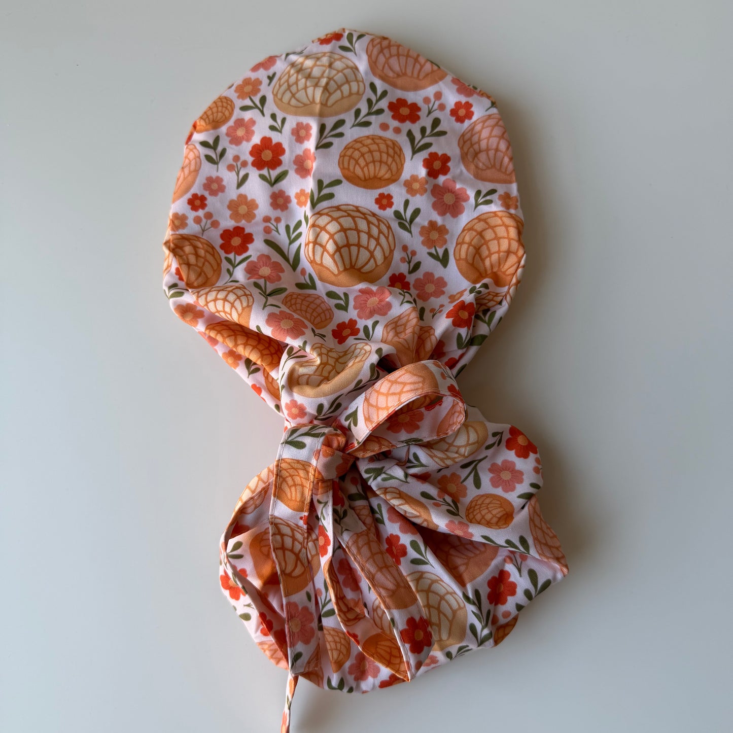 CONCHAS WITH FLOWERS SATIN LINED PONYTAIL SCRUB CAP