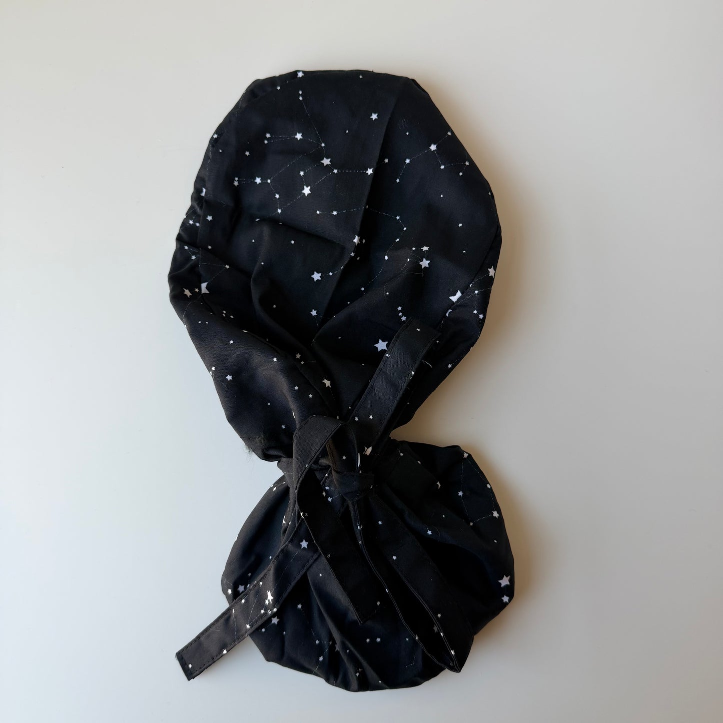BLACK CONSTELLATIONS SATIN LINED PONYTAIL SCRUB CAP